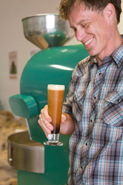 Erik Williams, Roast Master for Conundrum Coffee, checks out his draught coffee creation.